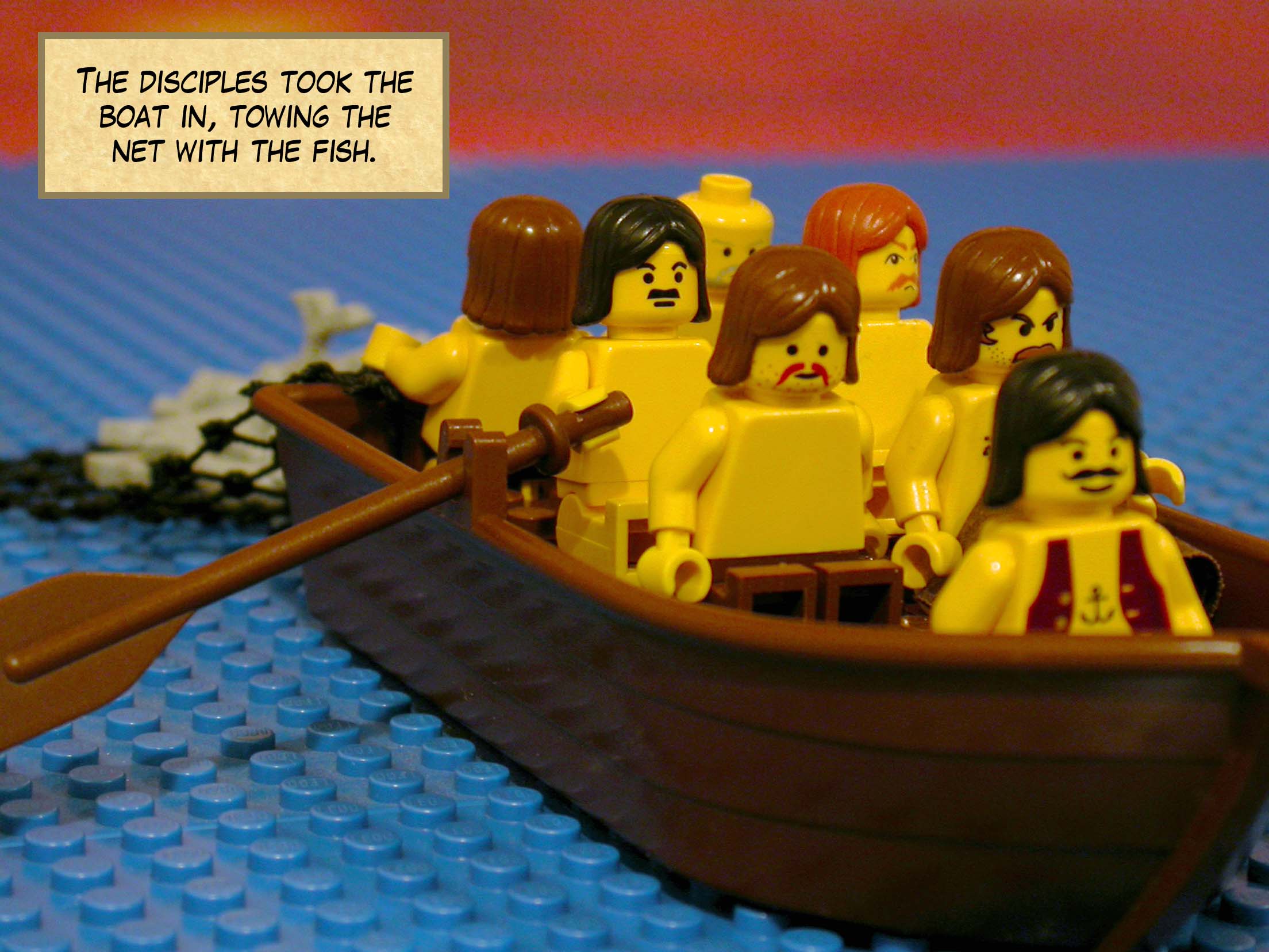 The disciples took the boat in, towing the net with the fish.<br>