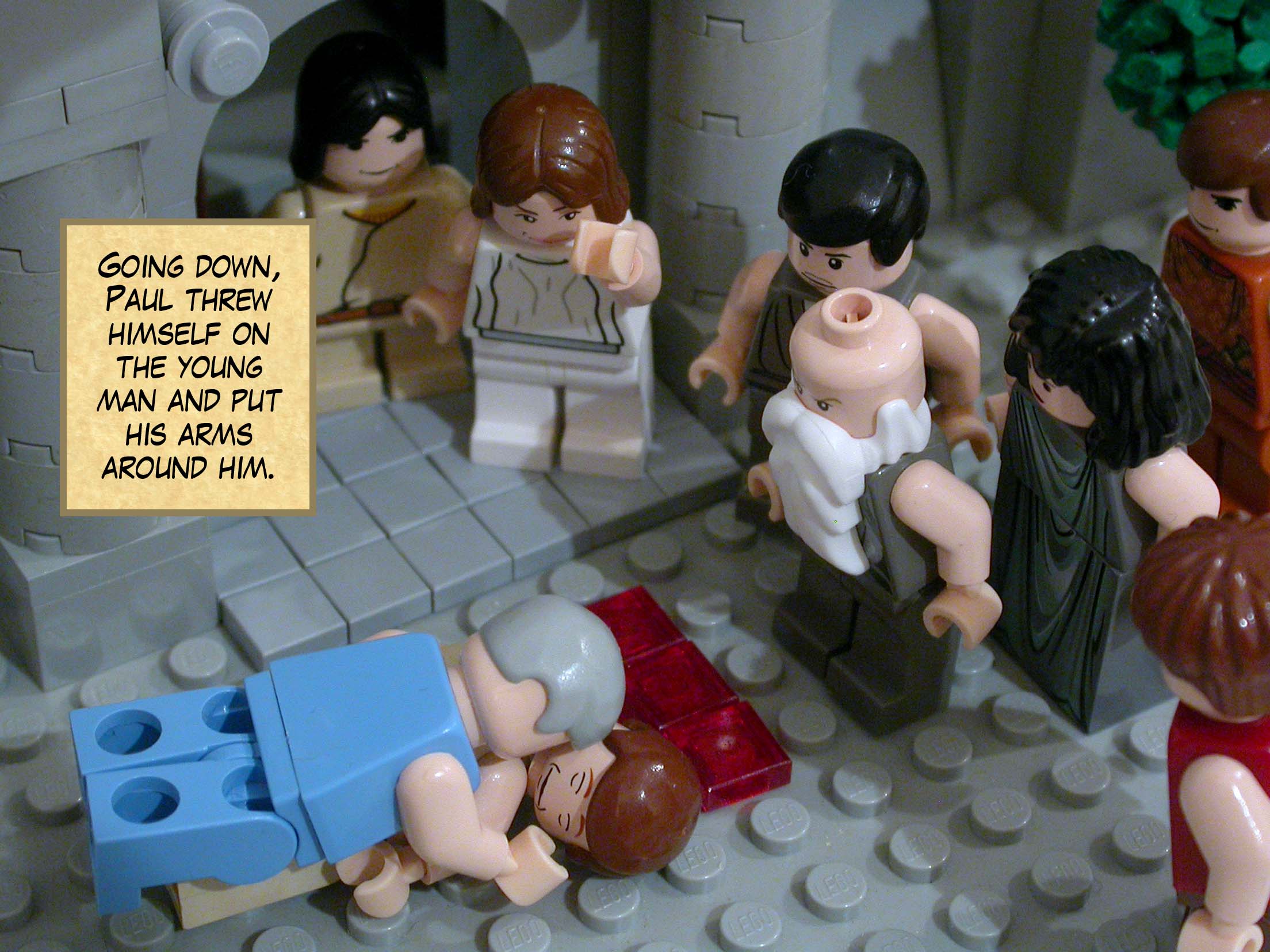 Going down, Paul threw himself on the young man and put his arms around him.