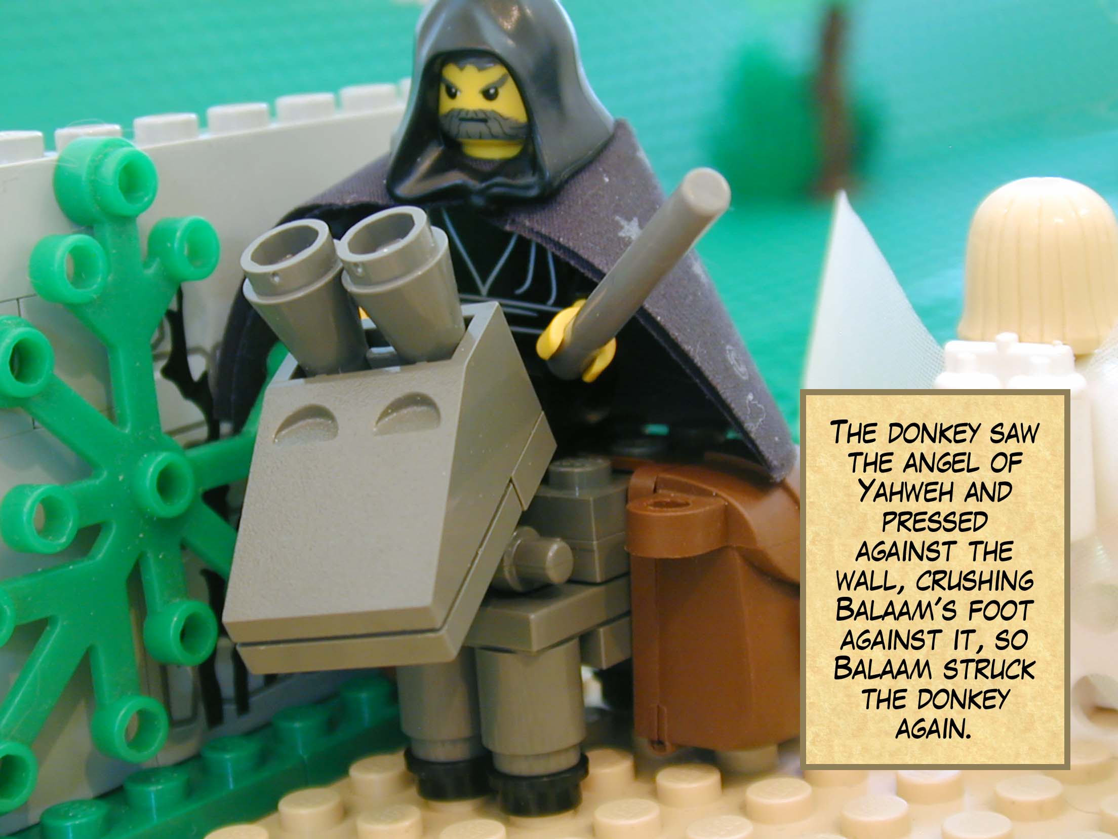 The donkey saw the angel of Yahweh and pressed against the wall, crushing Balaam's foot against it, so Balaam struck the donkey again.